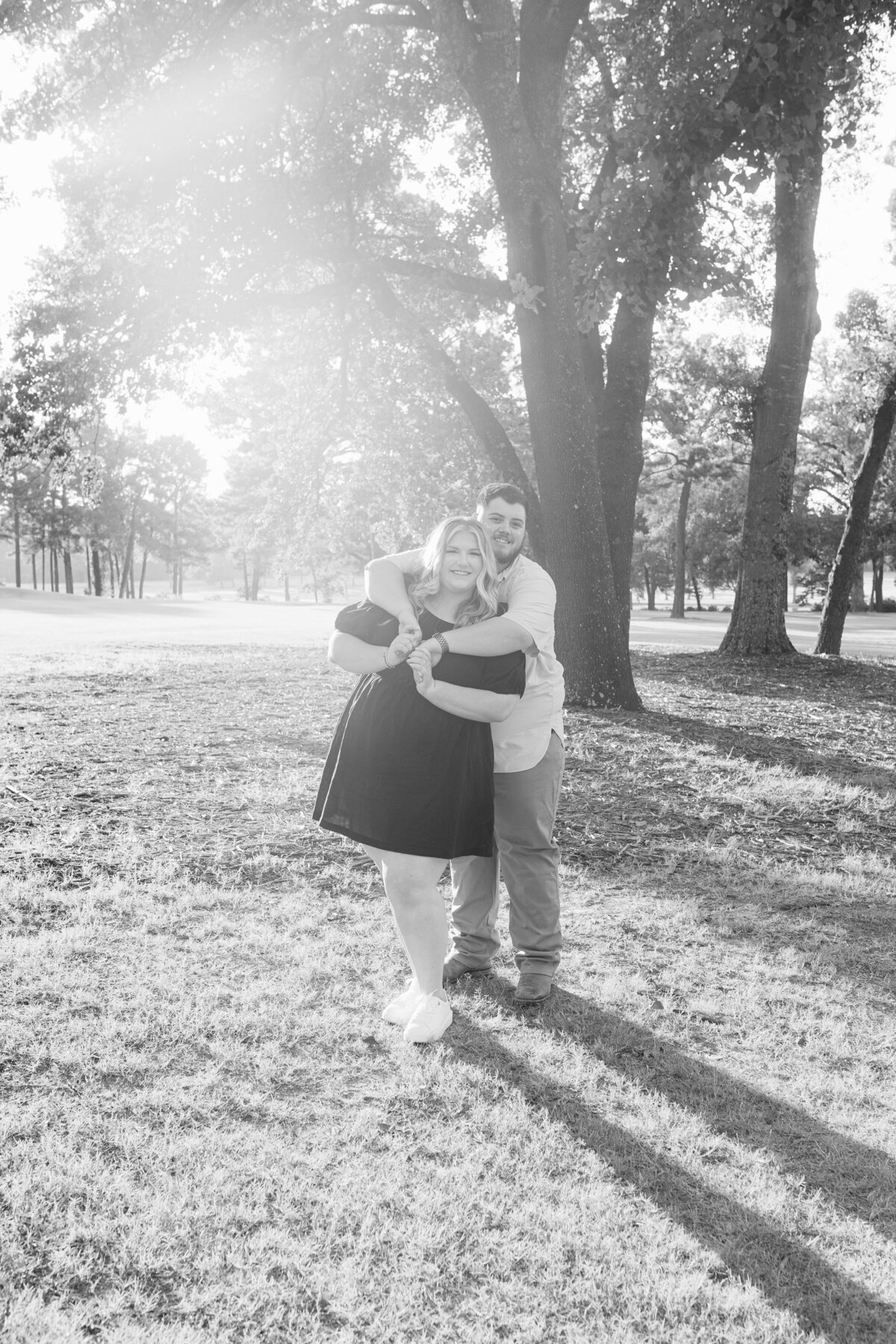 Happy couple holding each other in black and white photo