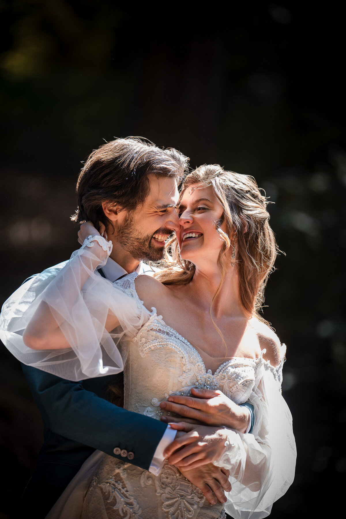 A couple cuddle at a destination wedding at Nestldown in Los Gatos, California
