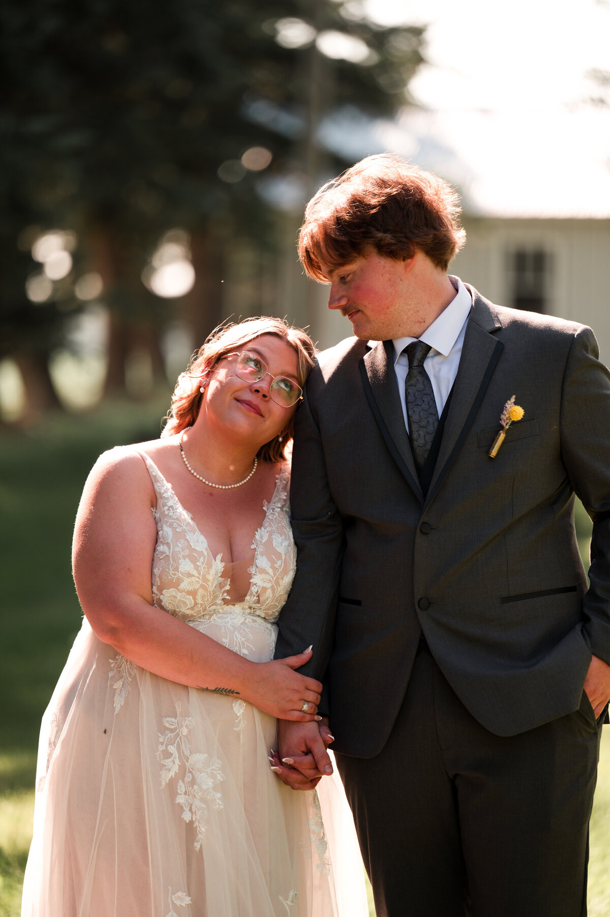Bride and groom looking at each other in close up wedding day portrait