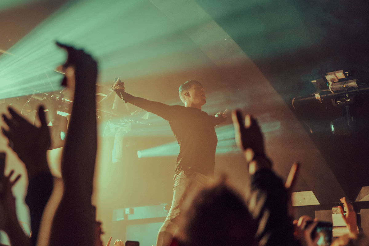 Cody Carson of Set It Off, performing at The Garage in London, stood on top of the crowd