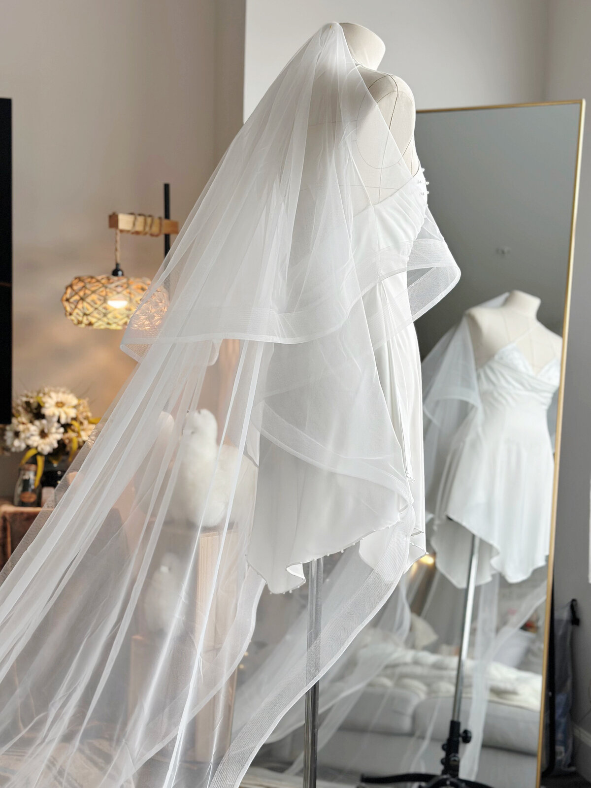 Soft lace blusher veil complementing vintage-inspired gown
