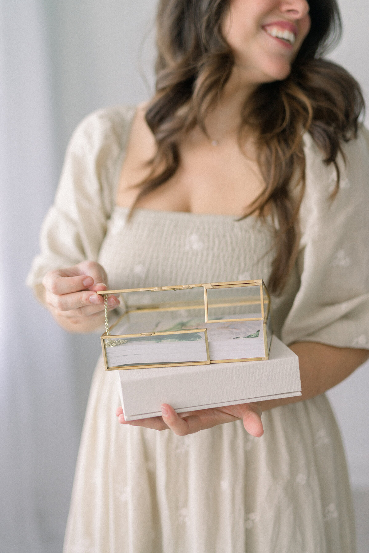 women holding boxes filled with photo prints knoxville tennessee newborn photographer