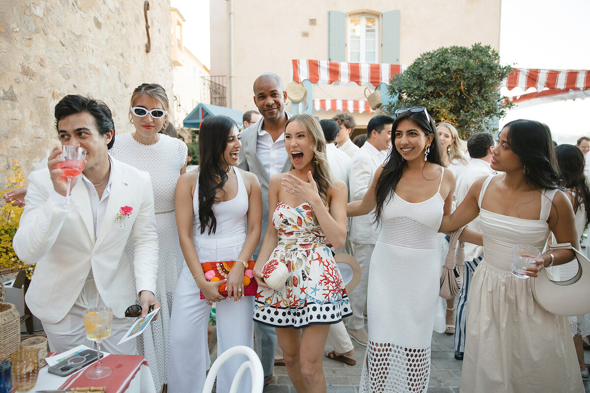 Romantic couple portraits at Bastide de Gordes with the bride in a silk fil-de-coupe wedding dress  and long wavy hair and the groom wearing a tan suit at sunset
