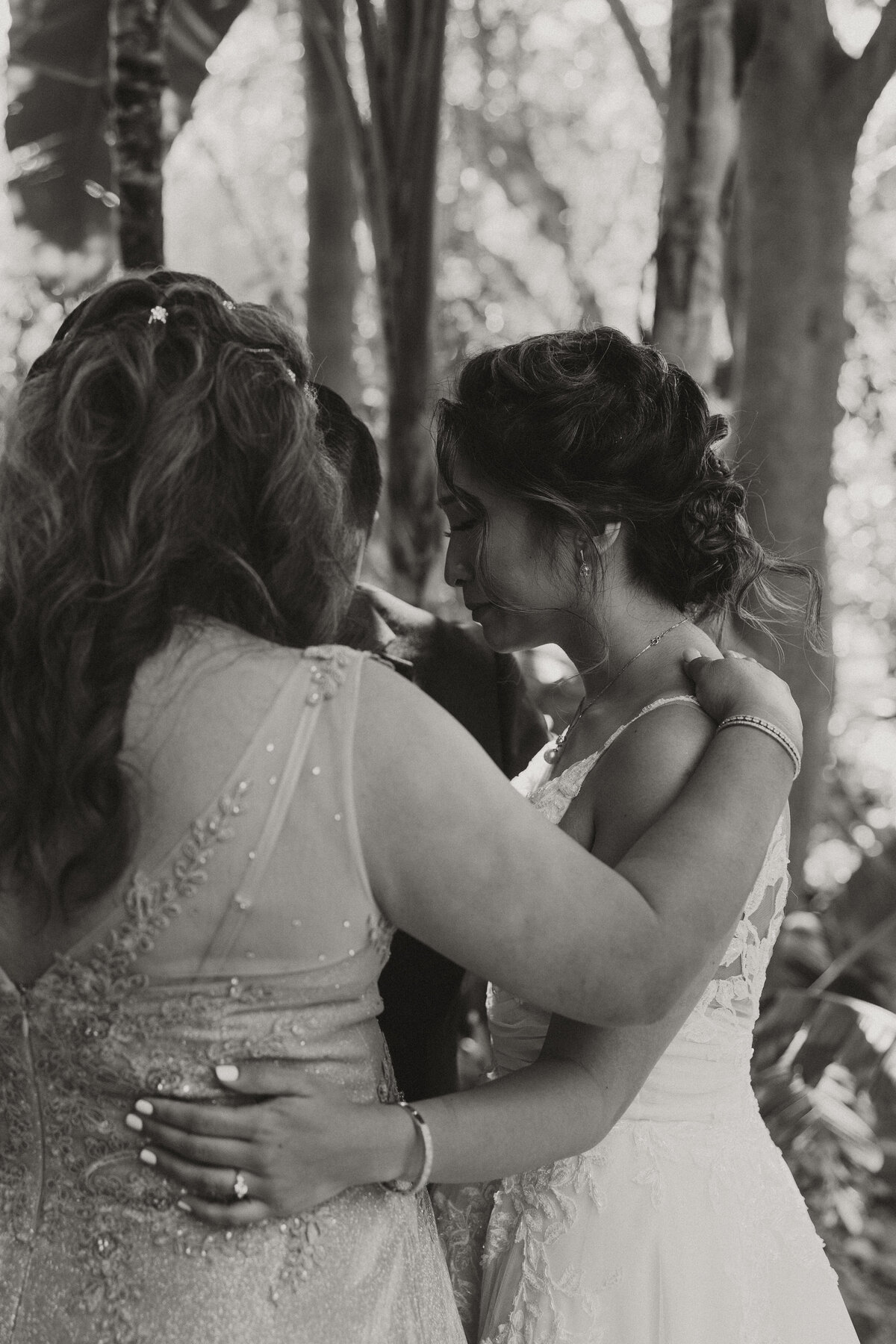 botanica wedding venue, bride praying with her parents