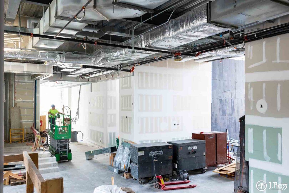 Construction site view showing the interior of the new ETSU Academic Building with newly installed drywall.