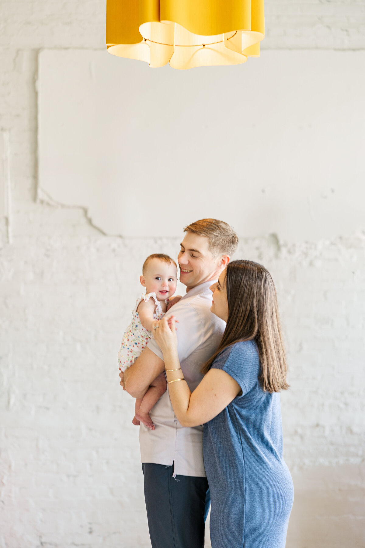 Family studio photo session by Claire Katan shot with natural light and true colors.