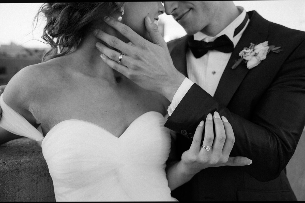 Bride embrace in black and white on the rooftop of a building in downtown Nashville, TN. 