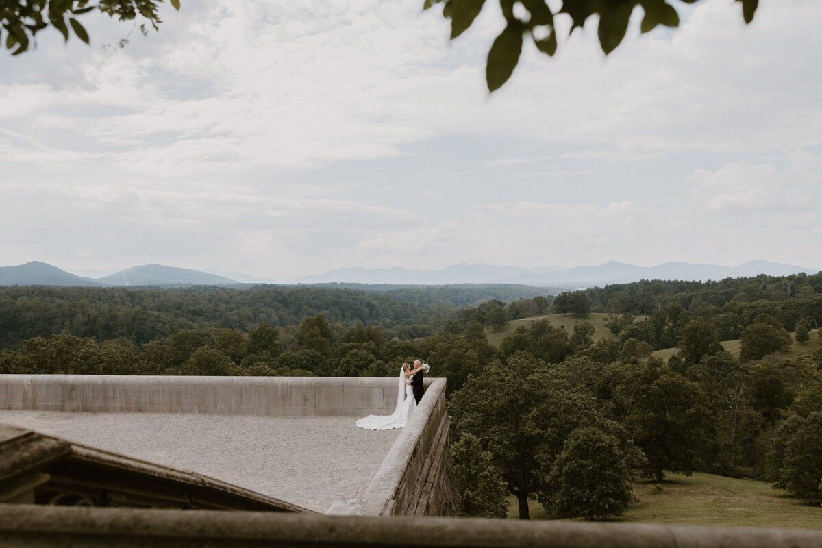 Bride and Groom on the iconic biltmore estate terrace in asheville nc