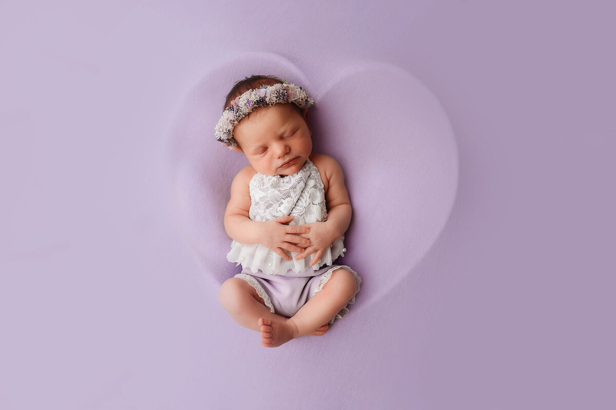 Baby posed for Newborn Photoshoot in Asheville, NC.
