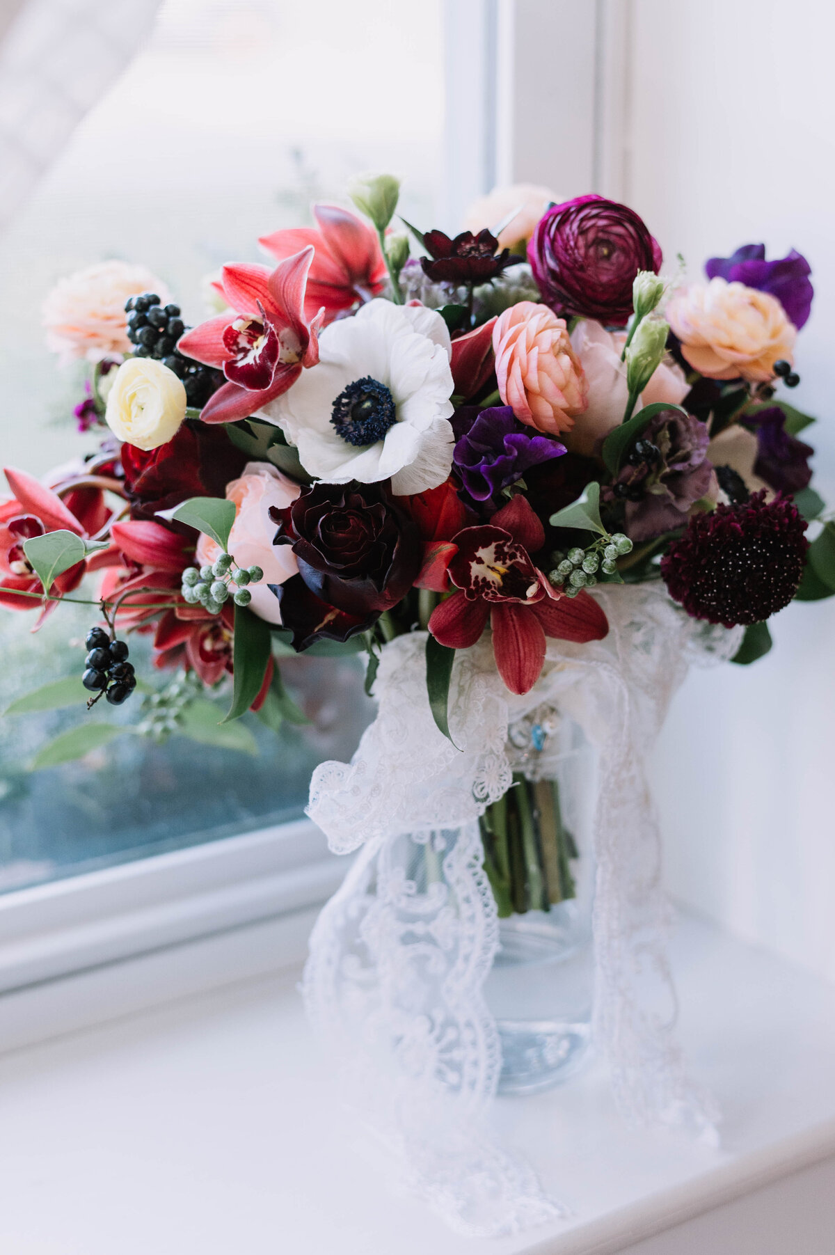 Anemone and orchid bridal bouquet Photo by Carolina Marles Photography