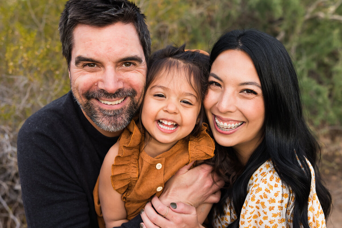 closeup of family smiling for photo