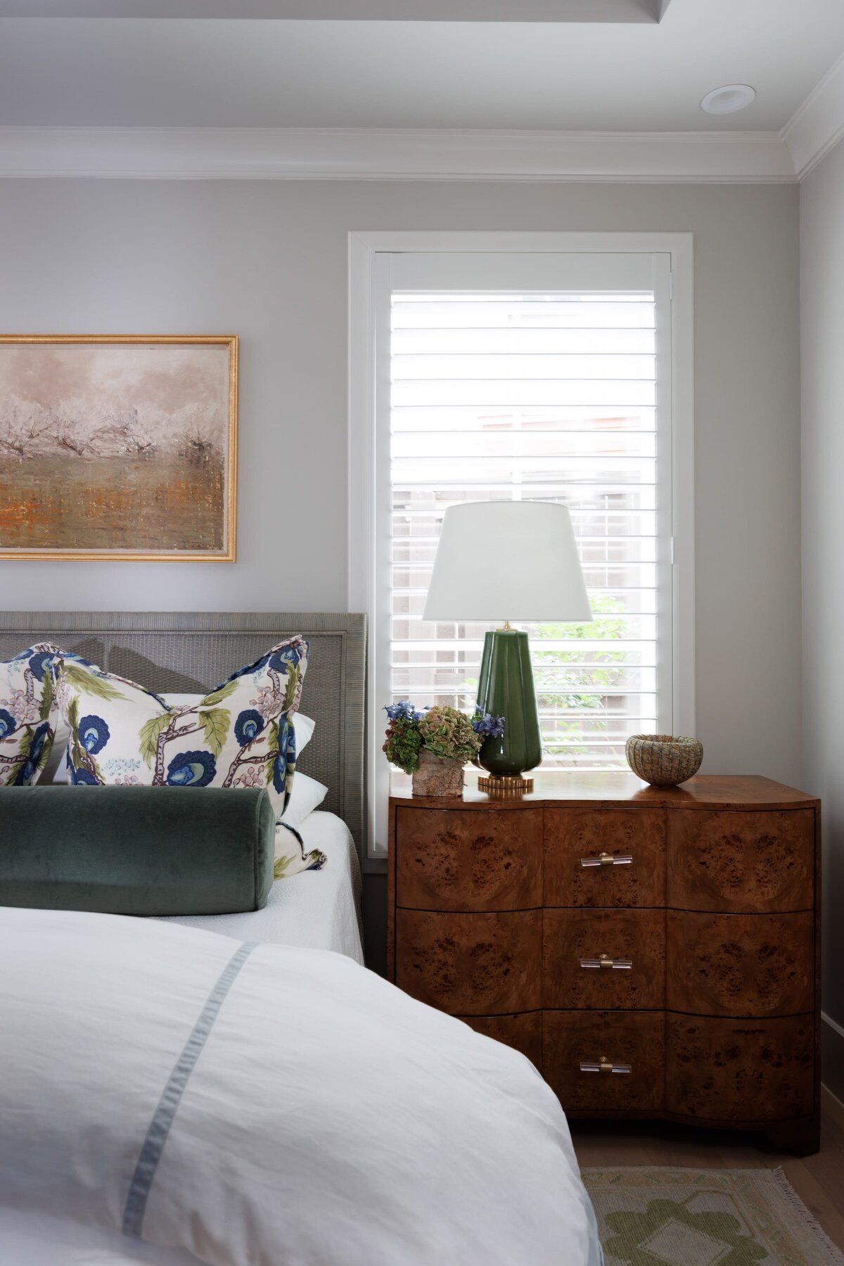 the keeping room interiors primera master bedroom with bedside table with green lamp