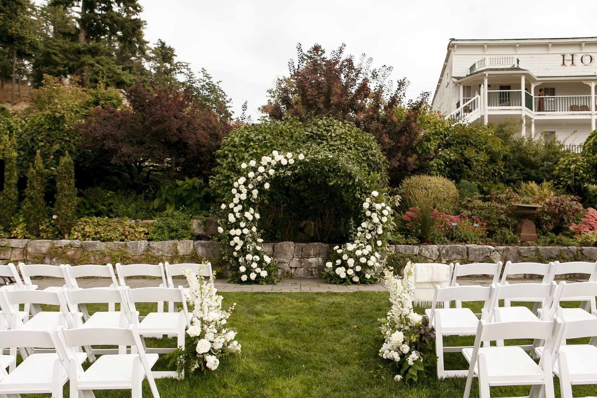 wedding with white circle arch at Roche Harbor wedding in garden