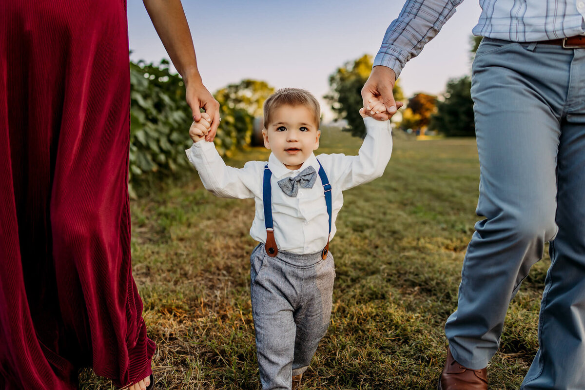 little boy in bow tie for maternity session