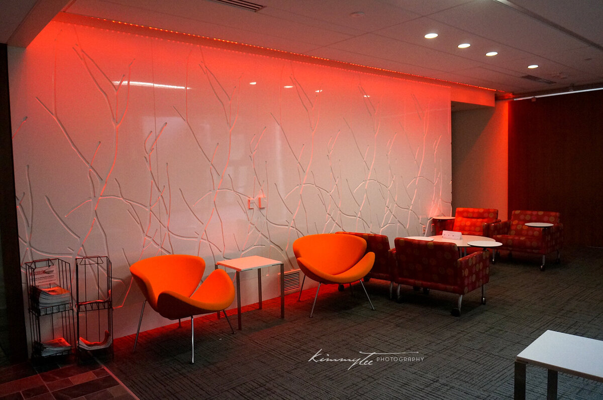 Lounge with chairs lit by bright orange light