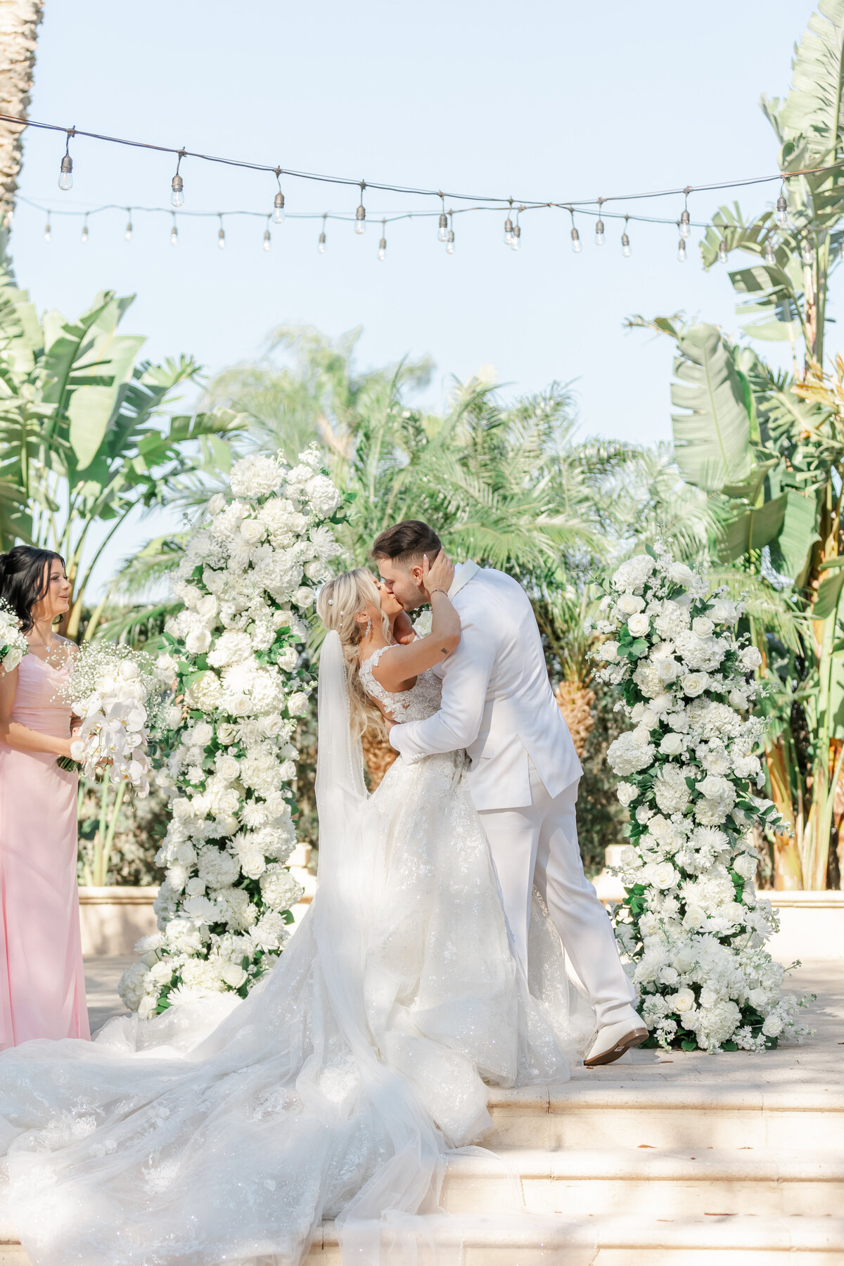 bride and groom first kiss by sarasota florida wedding photographer