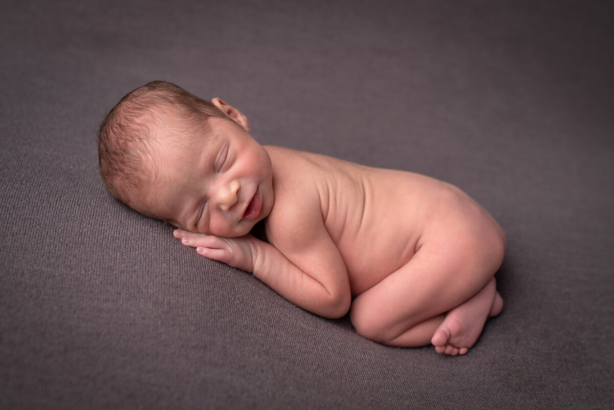 Smiling newborn Portrait capture in Houston