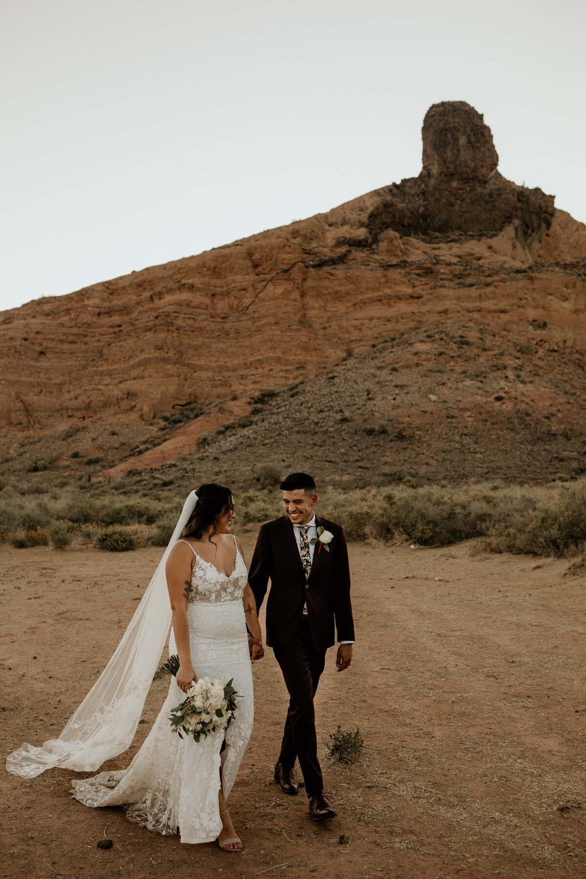 bride and groom walking together in Albuquerque