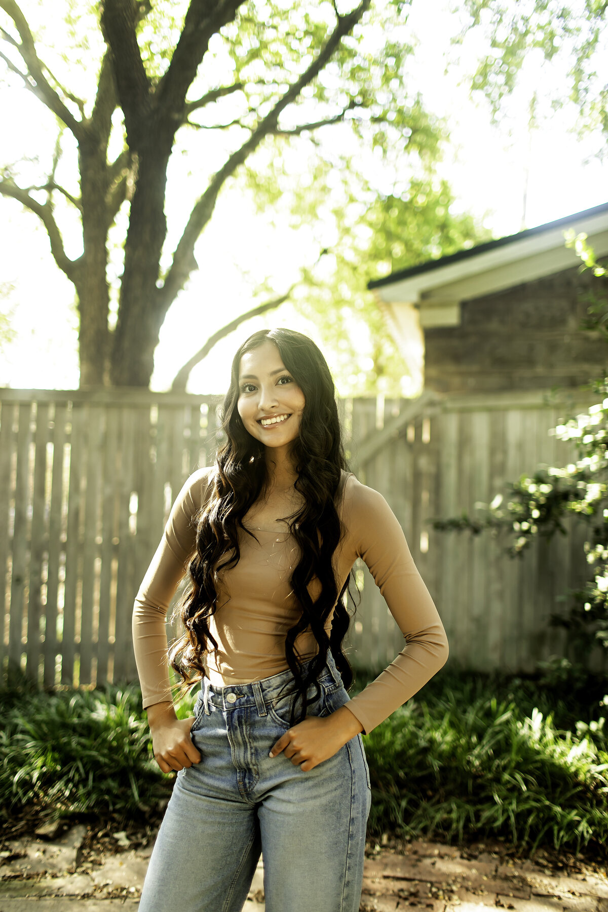 The peaceful surroundings of Chandor Gardens in Weatherford provide a stunning backdrop for a high school senior photoshoot filled with elegance and serenity