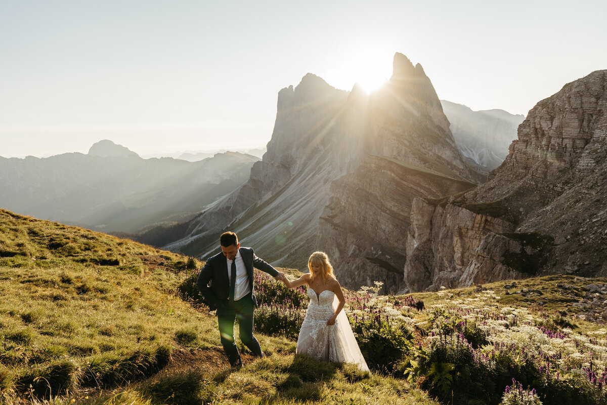 Wildflowers in foreground with bride and groom in distance