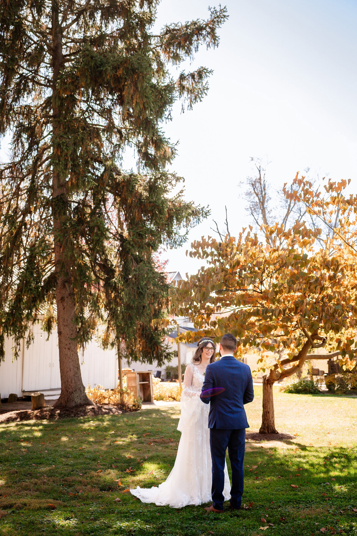 fall wedding outside of shady elms farm with changing autumn leaves