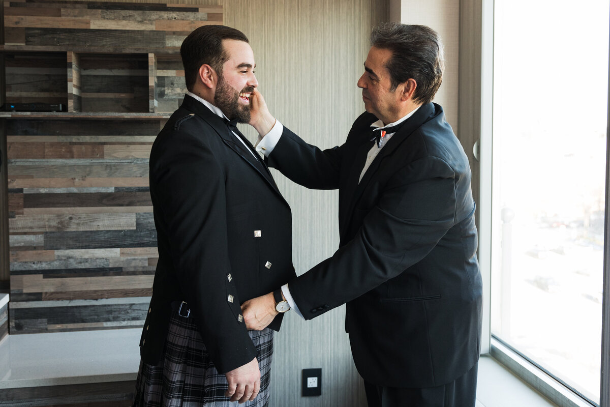 85 groom-and-dad-getting-ready