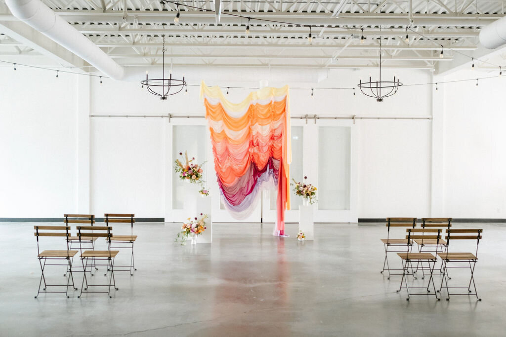 Bright and colourful wedding ceremony at The Brownstone, modern and elegant Calgary, Alberta wedding venue, featured on the Brontë Bride Vendor Guide.