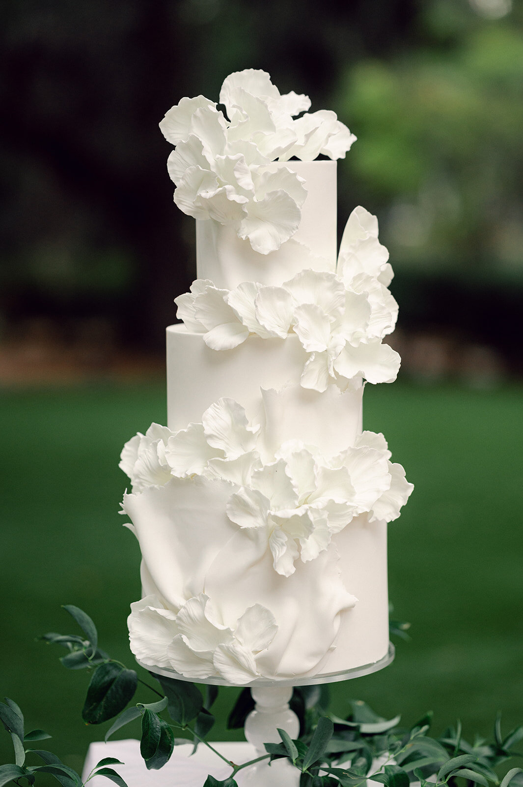 three tiered cake with elegant floral detail