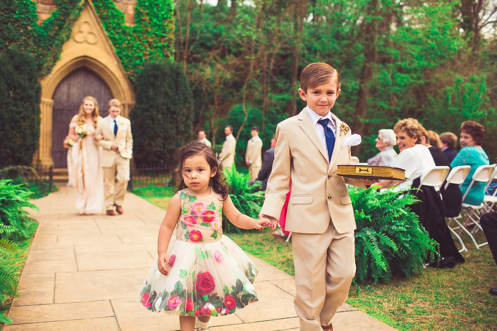 Wedding Photograph Of Ring Bearer And Little Girl Walking Down The Aisle Los Angeles