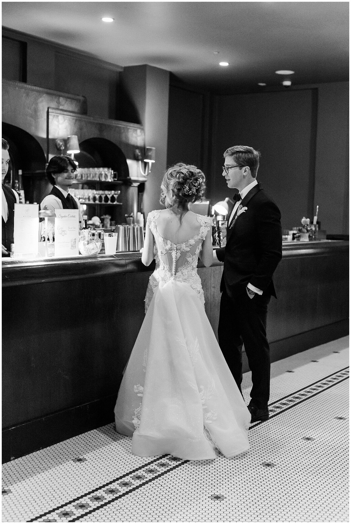 bride and groom at the bar at the white pillars biloxi
