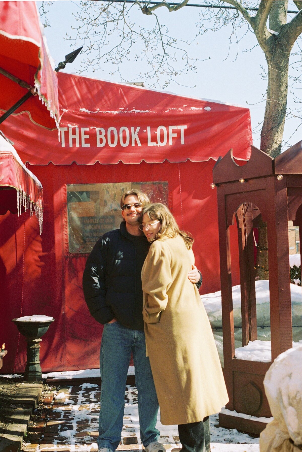 couple posing in front of book loft store, super 8 film photograph