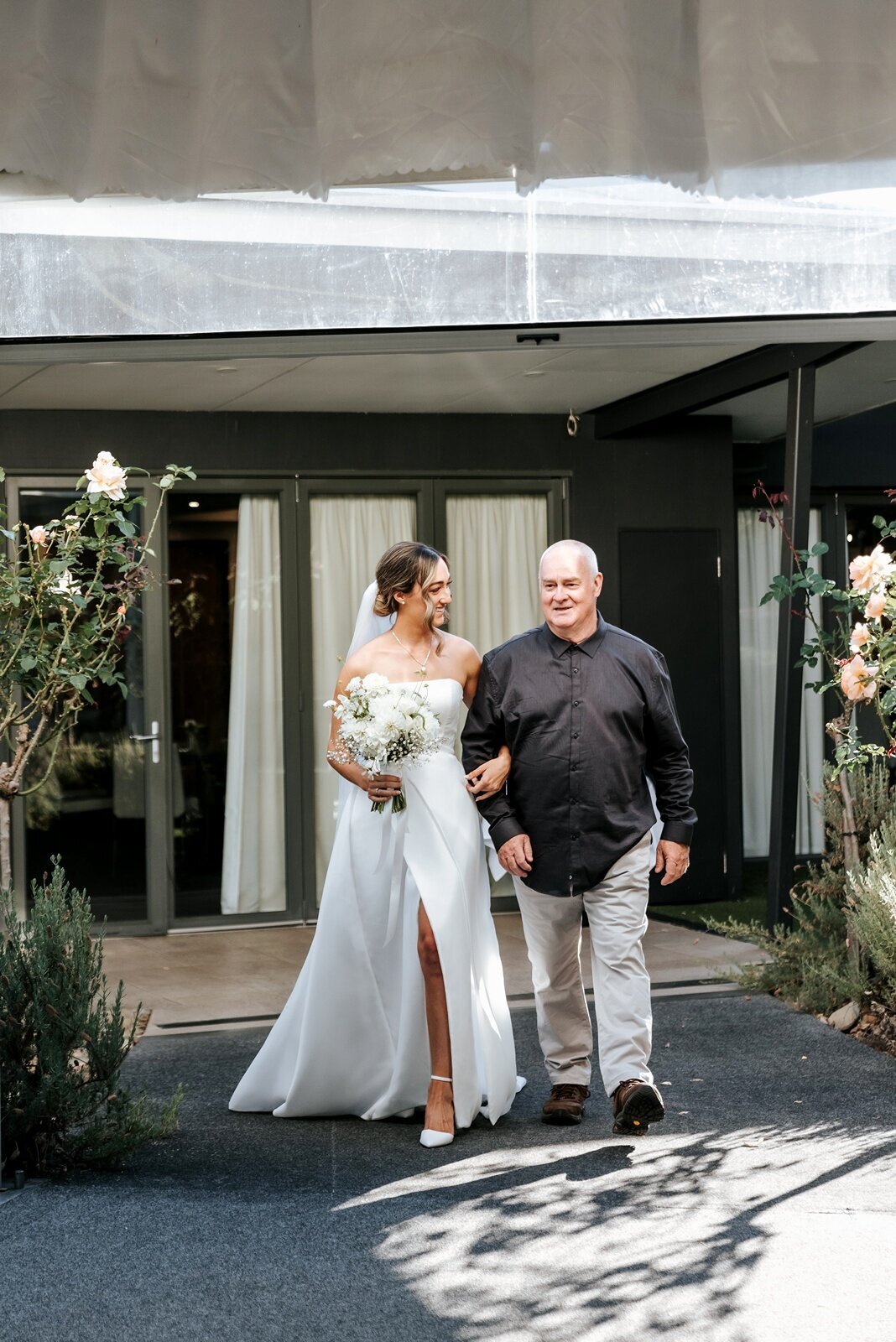 Bride walking down the aisle with her father at Balgownie Estate