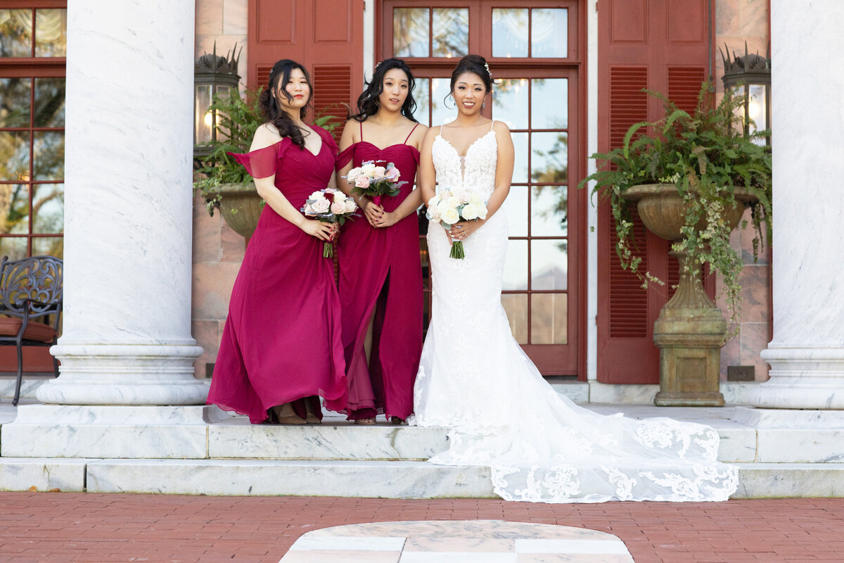 bride-with-bridesmaids-tate-house-front-steps-wedding-portrait