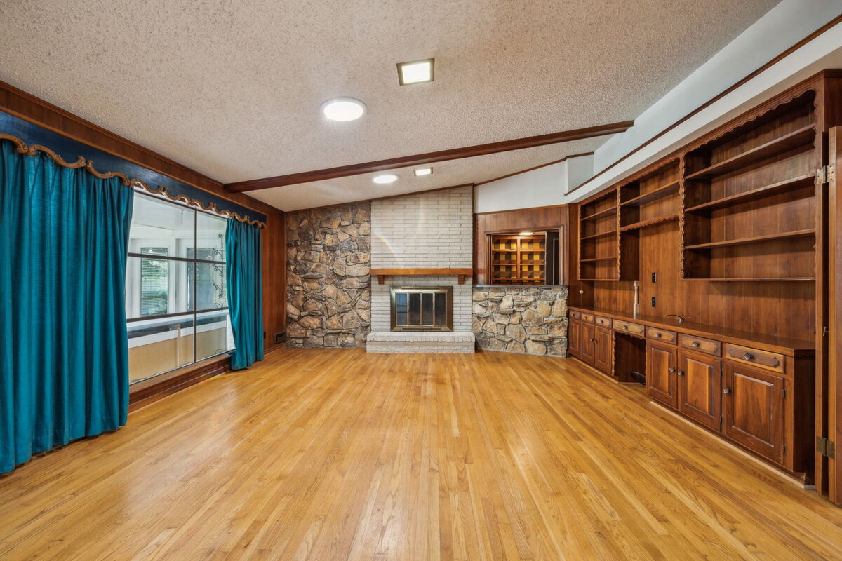 14214_edgecrest_dr_dallas_tx_family_room_-midcentury_fireplace_with_built_ins_and_exposed_beams-_haven_realty_group