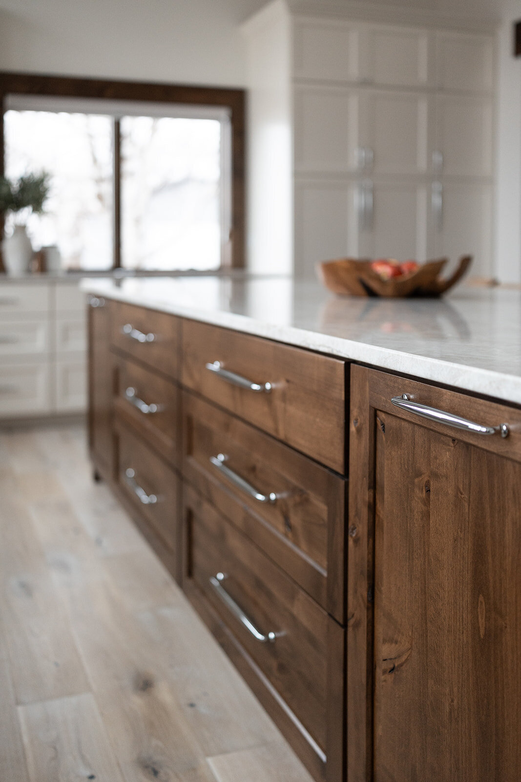 michele rosenboom design clean country renovation dark wood island drawers and silver handles