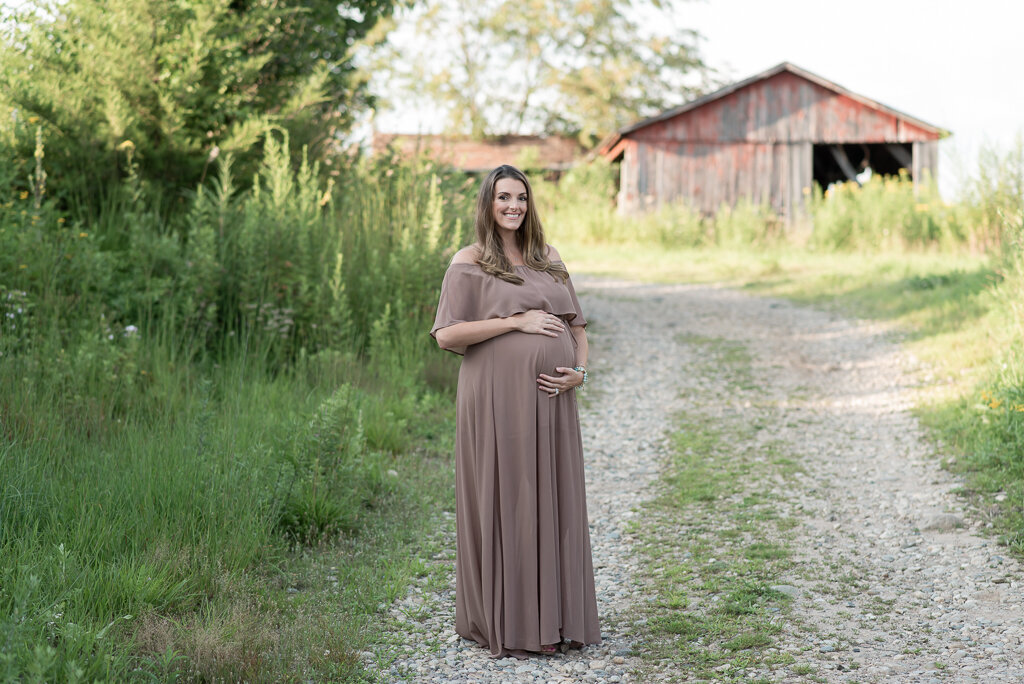 Pregnant mom in mocha dress standing in front of rustic barn | Sharon Leger Photography | CT Newborn & Family Photographer | Canton, Connecticut
