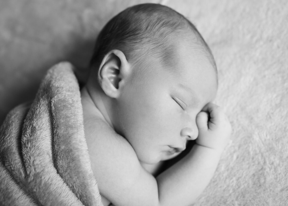 Shot in black and white by a leading newborn photographer for Haslemere