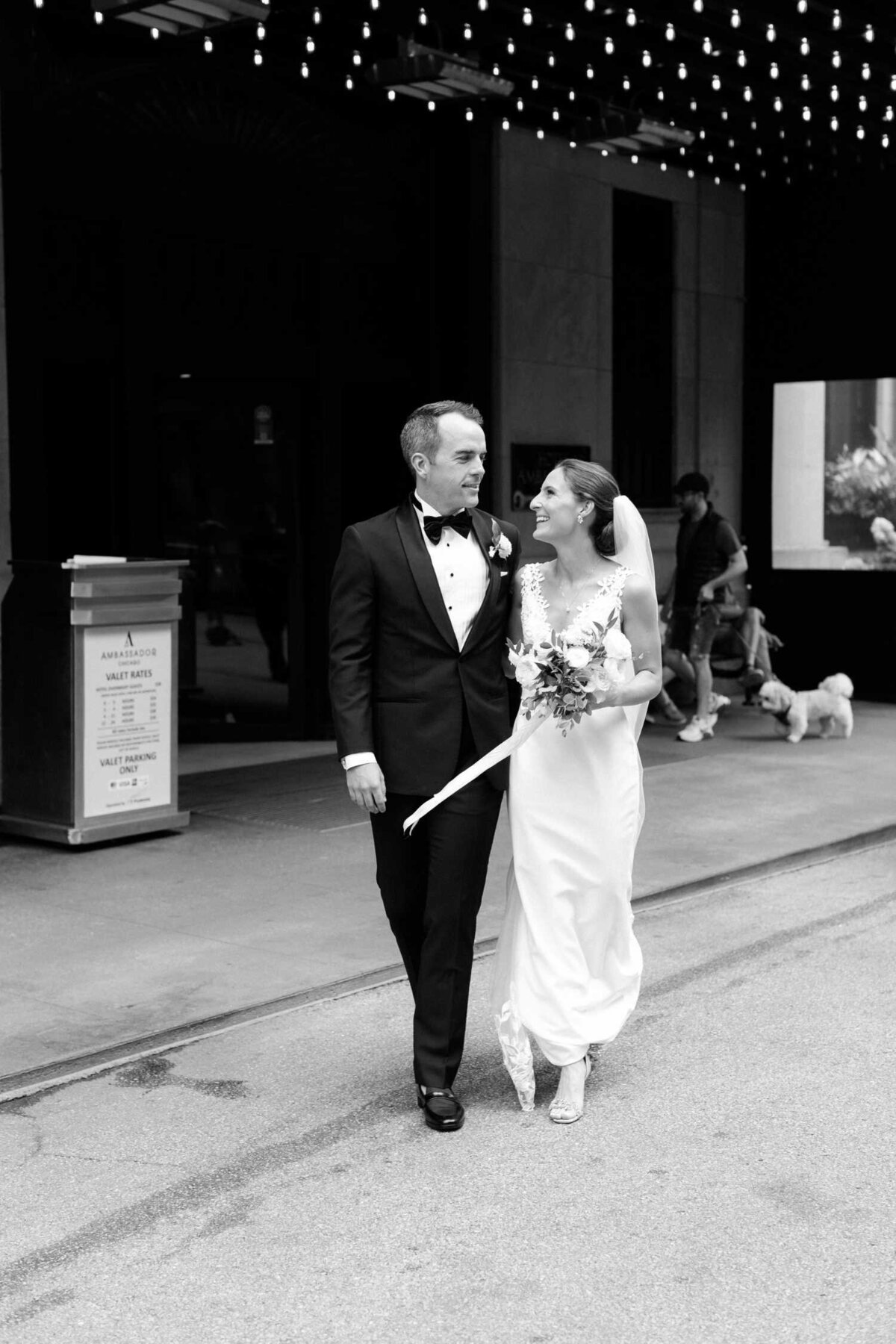 Black and White wedding day city street portrait outside the Ambassador Hotel before their Luxury Chicago Outdoor Historic Wedding Venue.