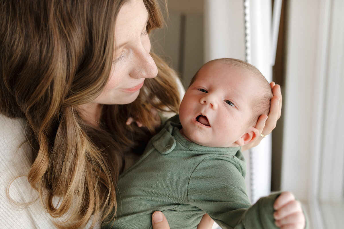 New Longmont mom looking at newborn