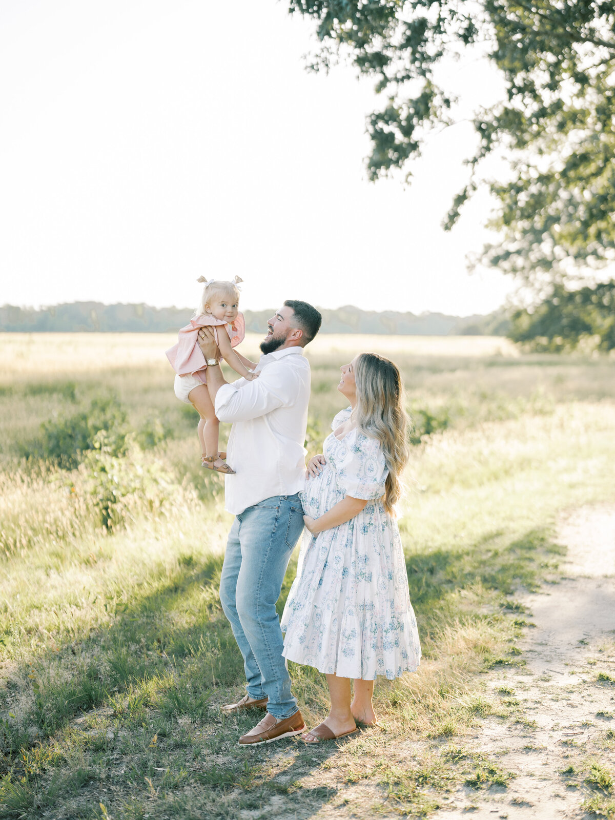 dad lifting daughter in air