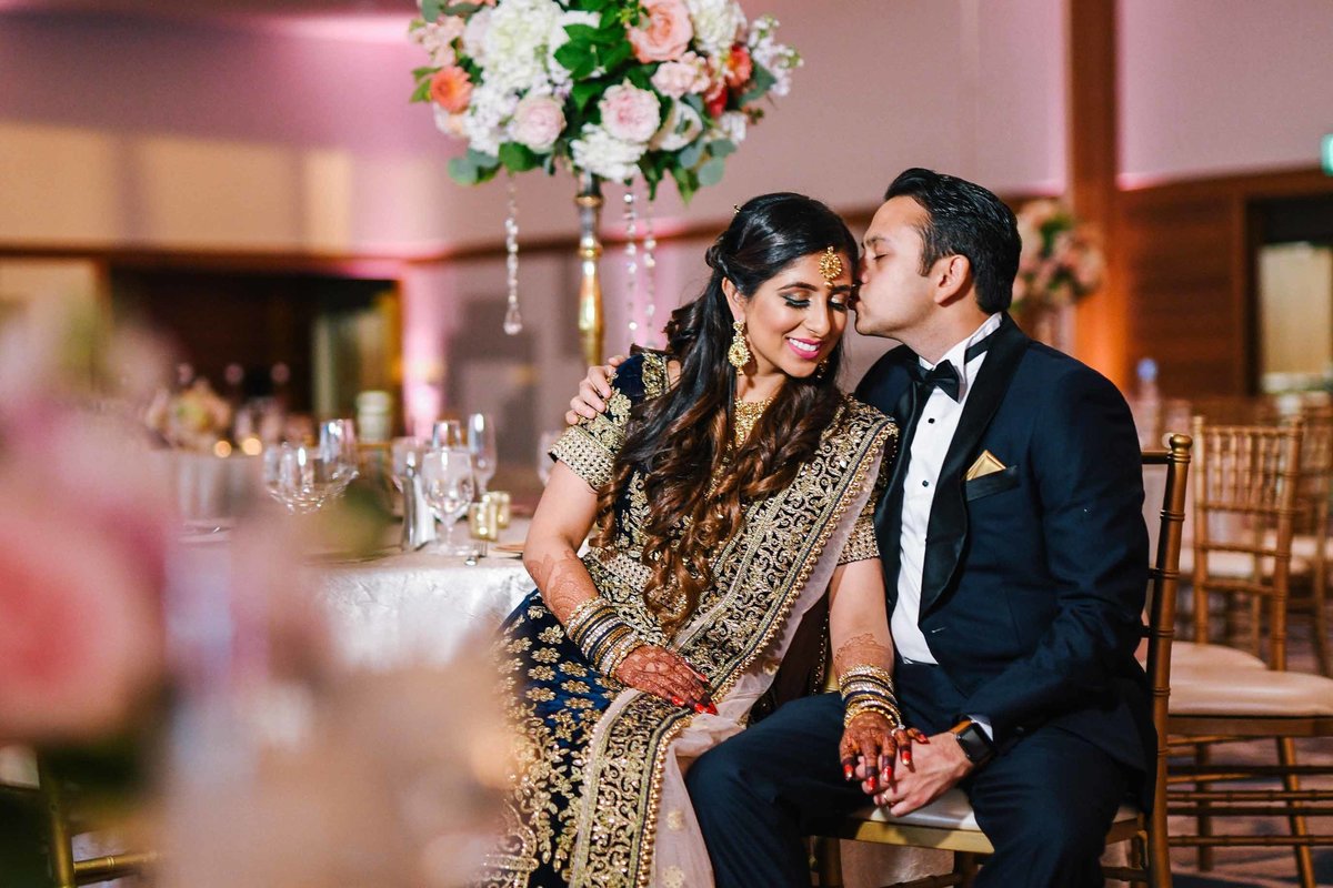 Stunning Indian couple at their wedding reception designed by Flora Nova Design.