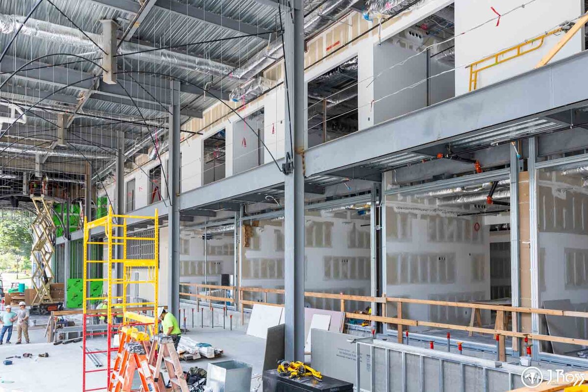 Construction site view showing the interior of the new ETSU Academic Building with newly installed drywall.