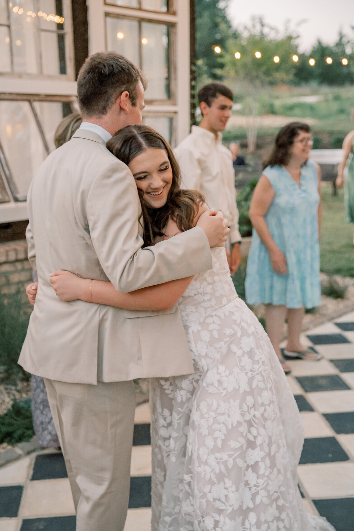 Three Oaks Manor Wedding | bride and groom share a hug on the dancefloor