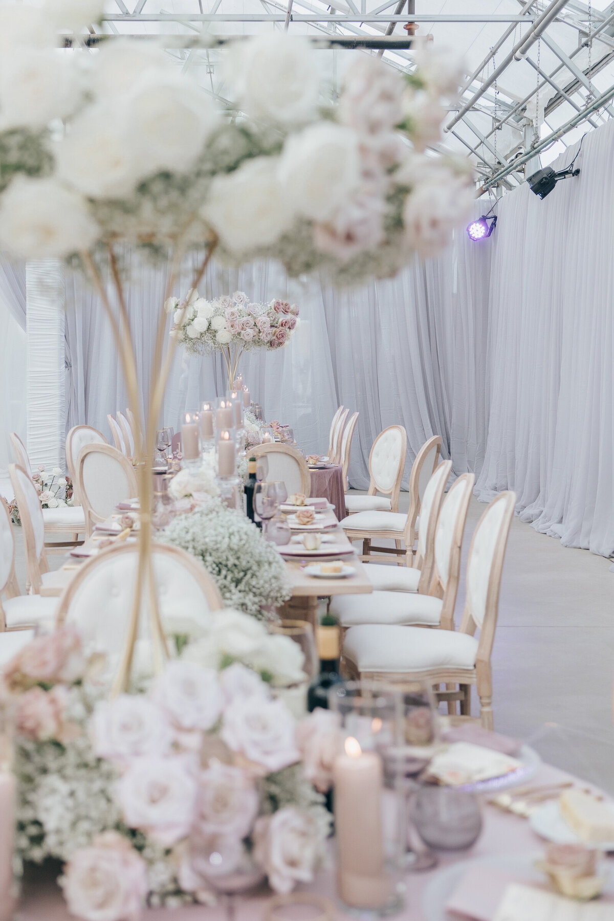 Elegant wedding dinner with roses and baby's breath at Twelfth Night Events