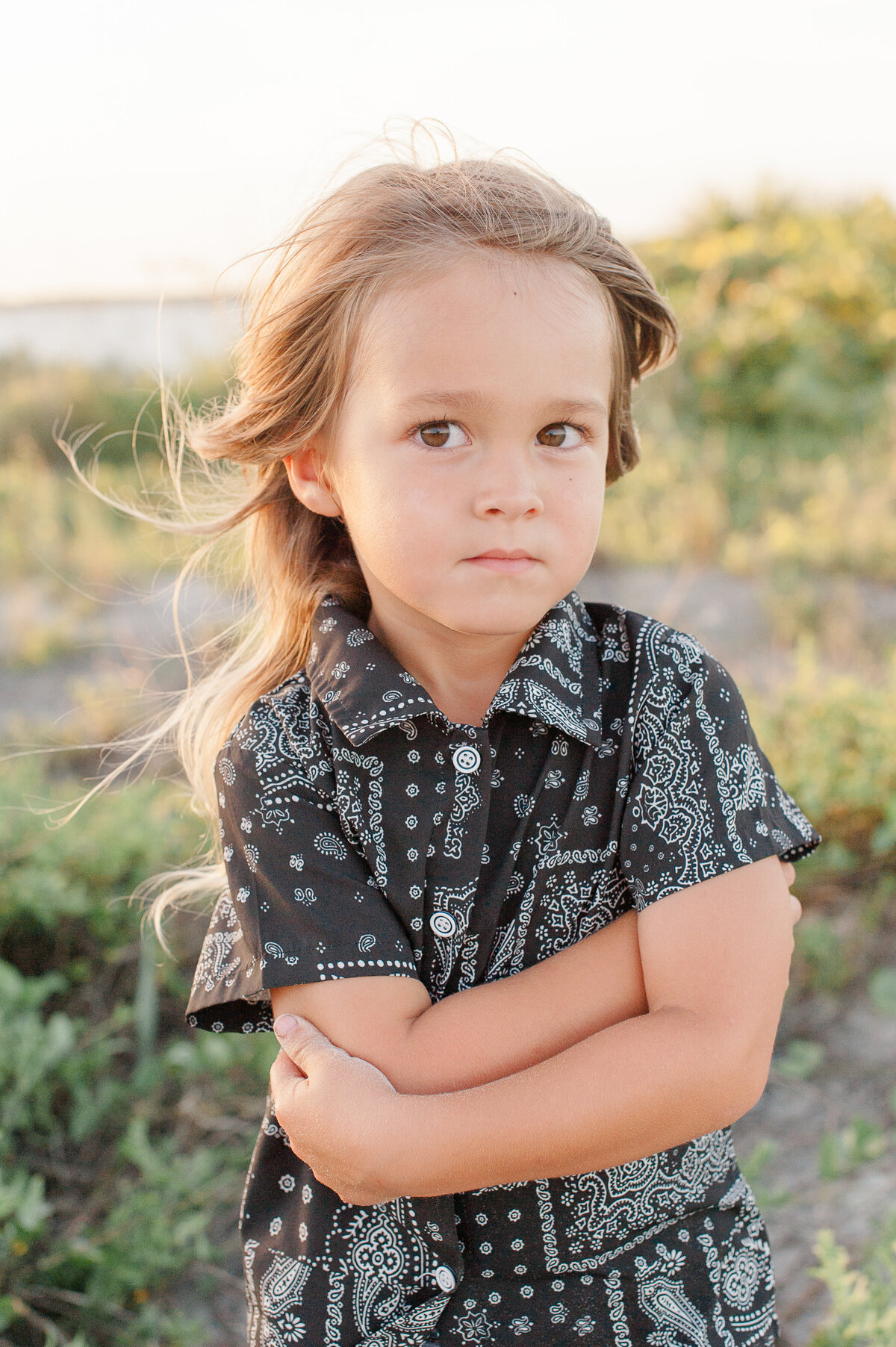 Young boy looking into the camera during golden hour