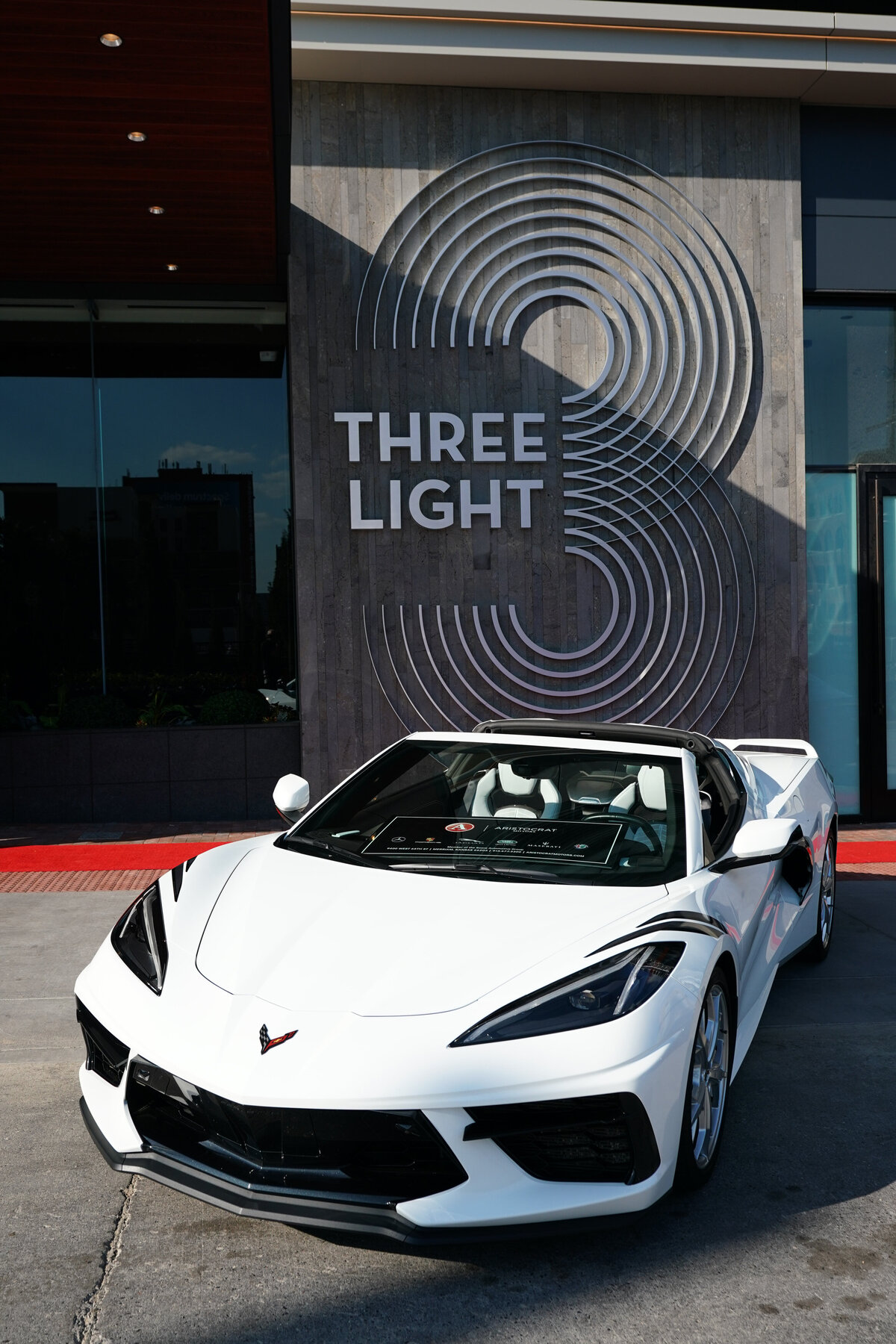 kansas-city-marketing-photography-products-0104-white-sports-car-in-front-of-building-sign