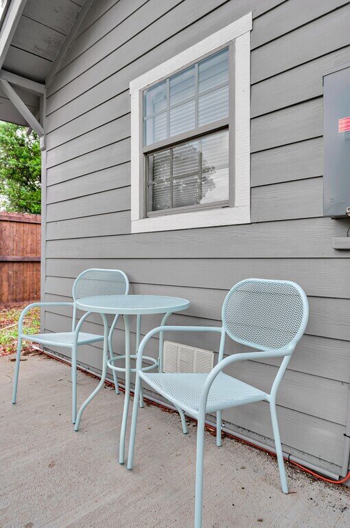 Back patio at this two-bedroom, one-bathroom vacation rental house for five located just 5 minutes from Magnolia, Baylor, and all things downtown Waco.