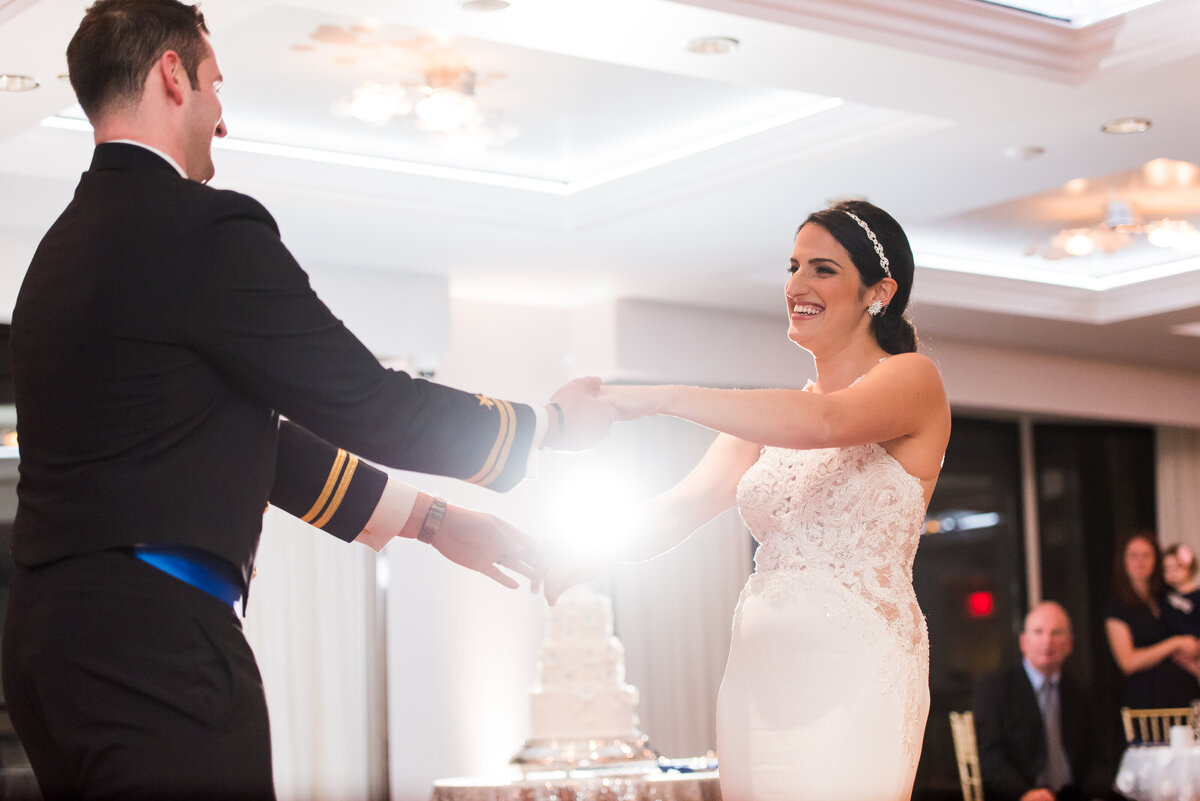 first dance bride smiling at groom in ballroom at renaissance pittsburgh
