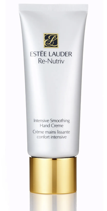 High-end skincare product in a sleek white bottle with silver accents, captured by Ylva Erevall.