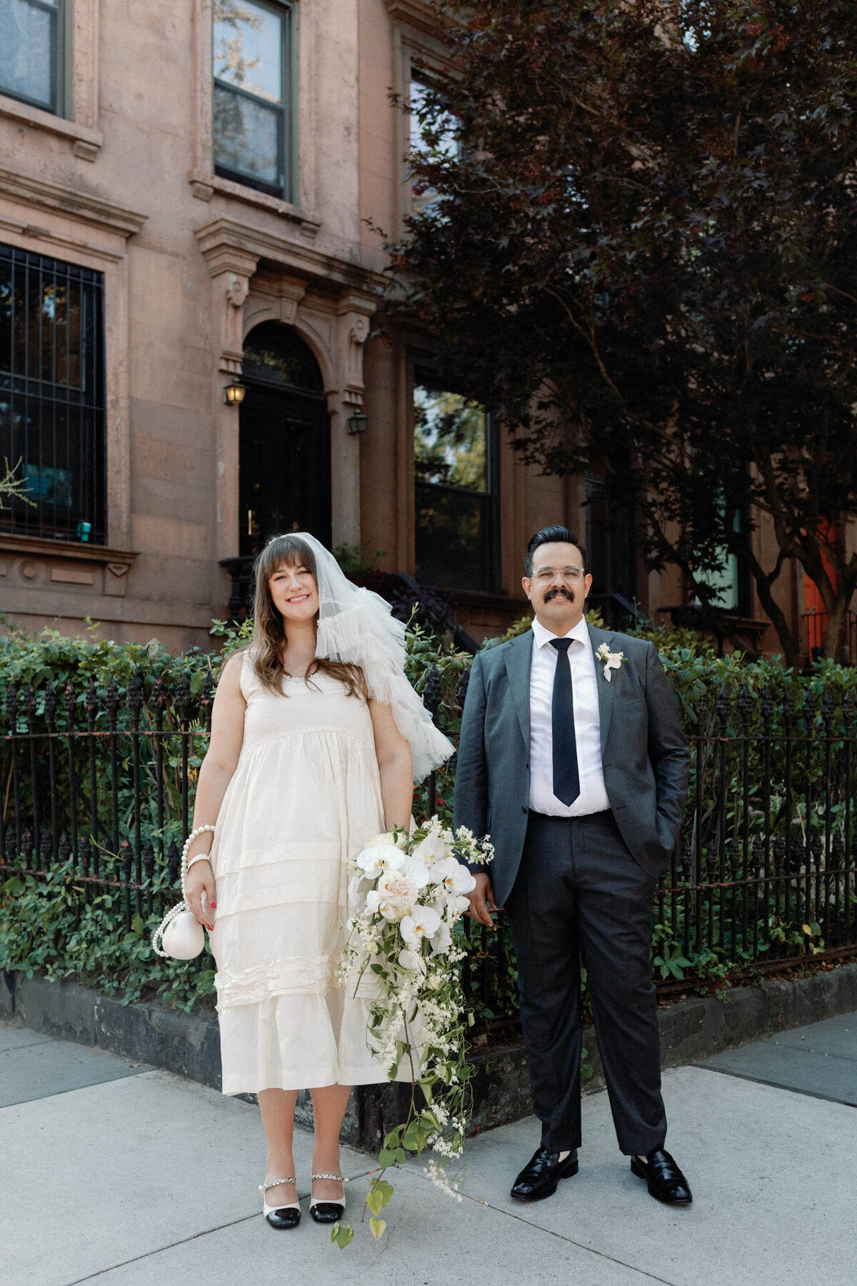 Brooklyn wedding with cascading bouquet simone rocha dress molly goddard veil miu miu shoes in cobble hill